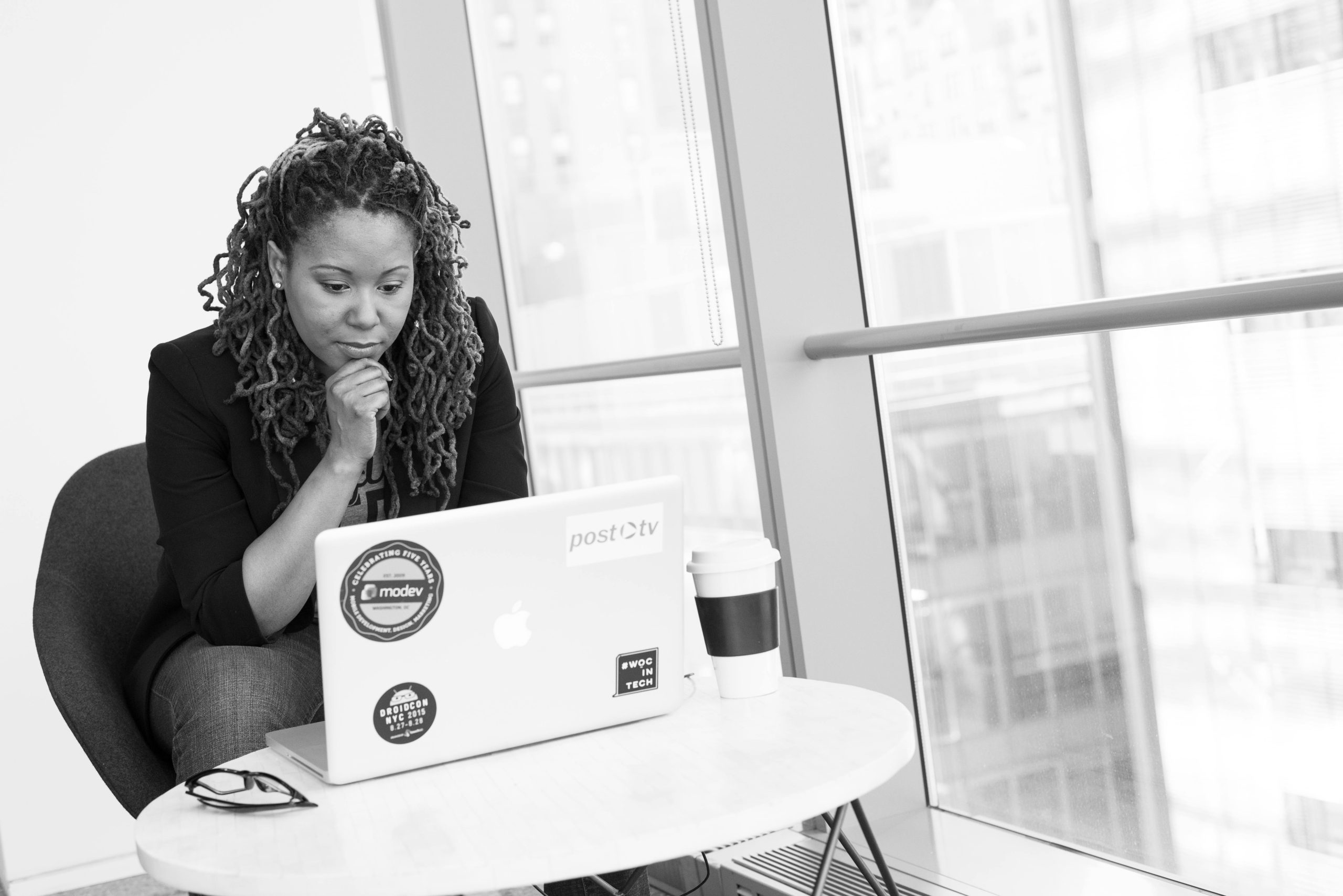 Woman researching on a laptop
